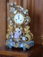 clock with flowers and girl figure