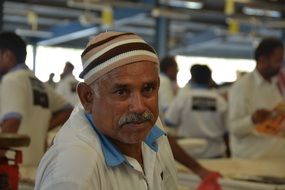 mature male Worker on Fish Market, uae, Dubai