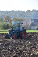 tractor plowing the ground