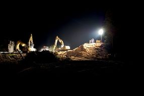 Construction work on construction site at night