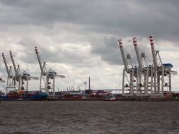 Distant view of harbor cranes in hamburg