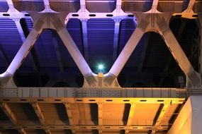 illuminated bridge in the dark