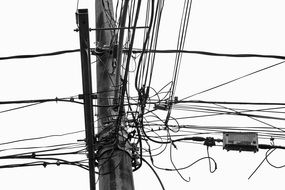 black and white image of power lines at sky background