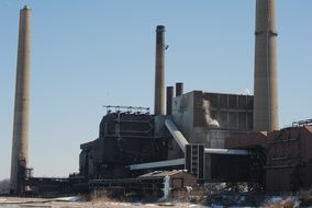 view of an industrial factory with pipes