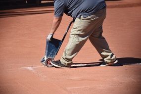 worker on the baseball field