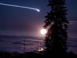 full Moon and Aircraft in Night Sky