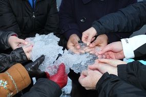 hands of a team in ice