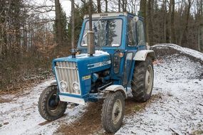 Ford Tractor in the snow in the forest