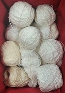 skeins of yarn in a red box