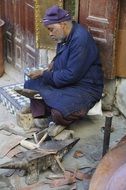 man works on the street in morocco