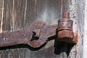 rusty door hinge close up