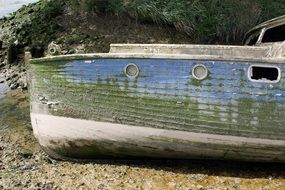 old boat on shore close up