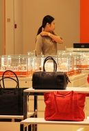 the seller of fashion bags in store