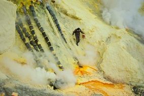 man goes on a volcano in indonesia