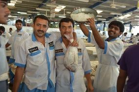 workers at the fish market in dubai