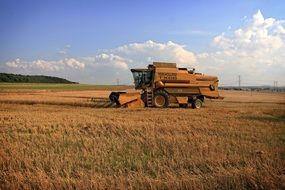 harvester on a field on a sunny day