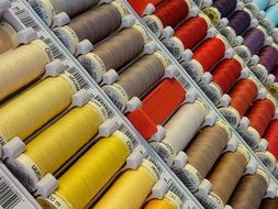 threads of different colors on the counter