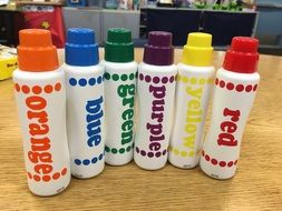 paints of different colors in cans