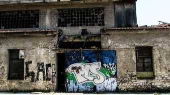 bright graffiti on the walls of an abandoned factory, greece, volos