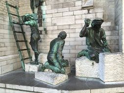 sculptures of workers