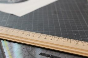 wooden Ruler on grided Work Surface