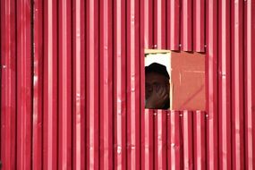 pink building fence close up