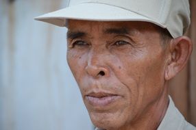 portrait of a man in white cap in Thailand