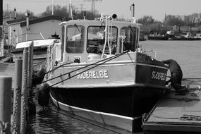 black and white image of a barge in the port of hamburg