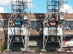 two industrial cranes in production