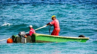 uniformed Workers in Boat on sea