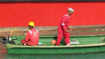 seaport workers in red overalls