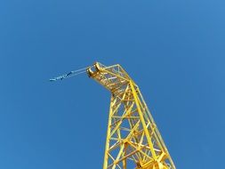 yellow tower crane