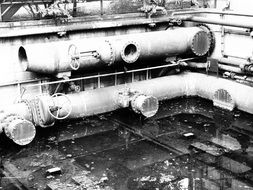 black and white image of industrial pipes