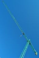 turquoise construction crane