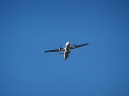 Aircraft with two Propellers on wings in blue sky