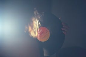 vinyl record in hand