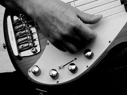 man hands playing guitar