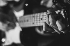 guitar in the hands of a musician