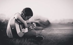 Boy playing Guitar Outdoor