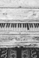 black and white image of a vintage piano