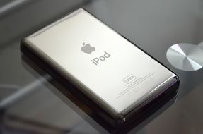 silver ipod on a glass table