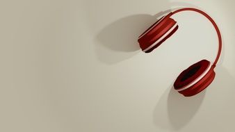 red headphones on a white surface