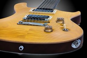 yellow electric guitar close up
