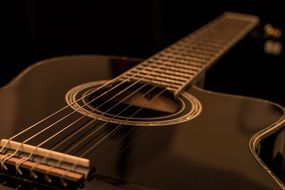 acoustic black guitar close-up