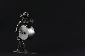 Metal Figure with Drum, black and white