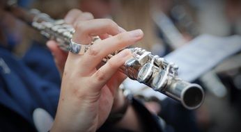 Girl plays flute on the street