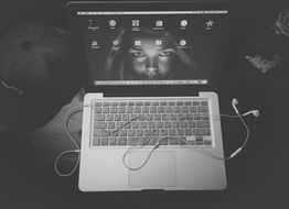 black and white picture of a laptop Apple