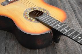 classical guitar lies on a laminate