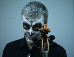Mon Cordes with painted mask and violin