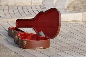 guitar case in the middle of the street